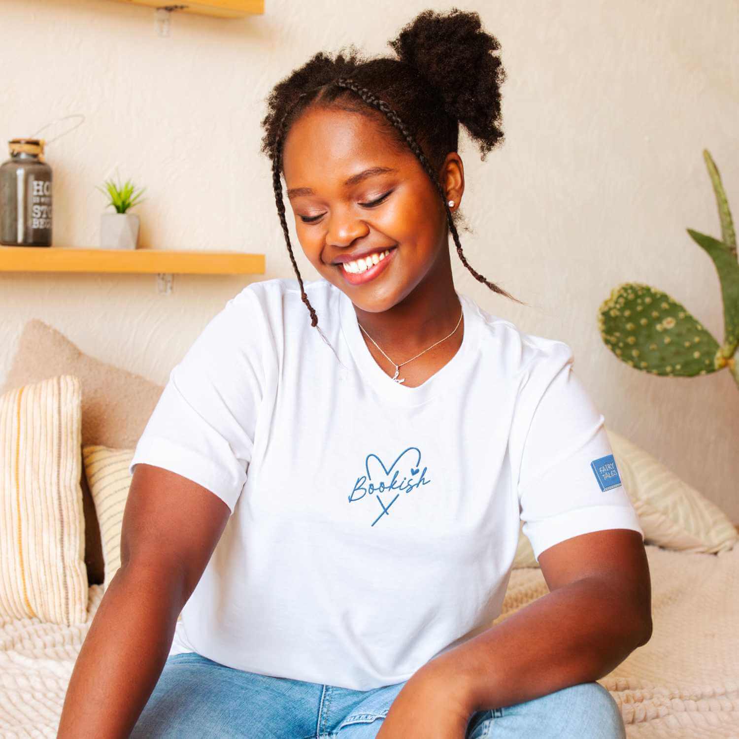 Minimalist embroidered tee in navy with feminine bookish touches. Comfortable and stylish bookish t-shirt gift for cozy reading fans.