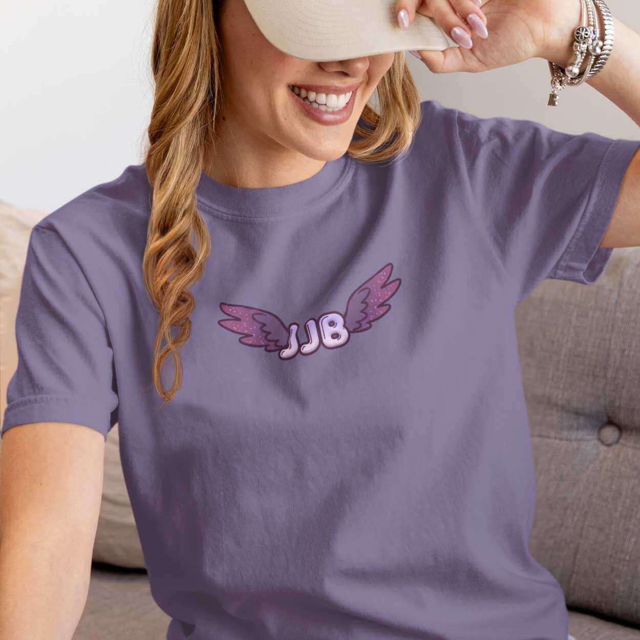 Front of JJB shirt with winged initials in purple