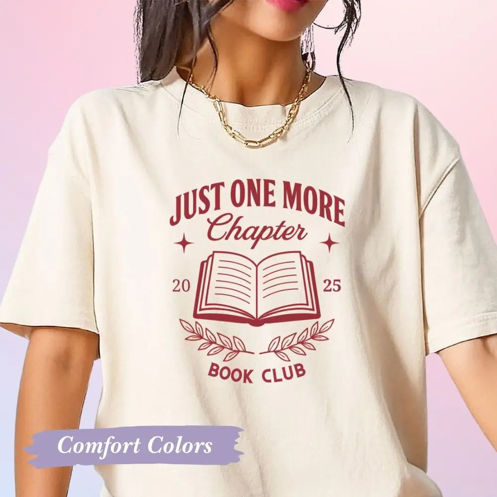 White t-shirt with 'Just One More Chapter Book Club' design on a pink background