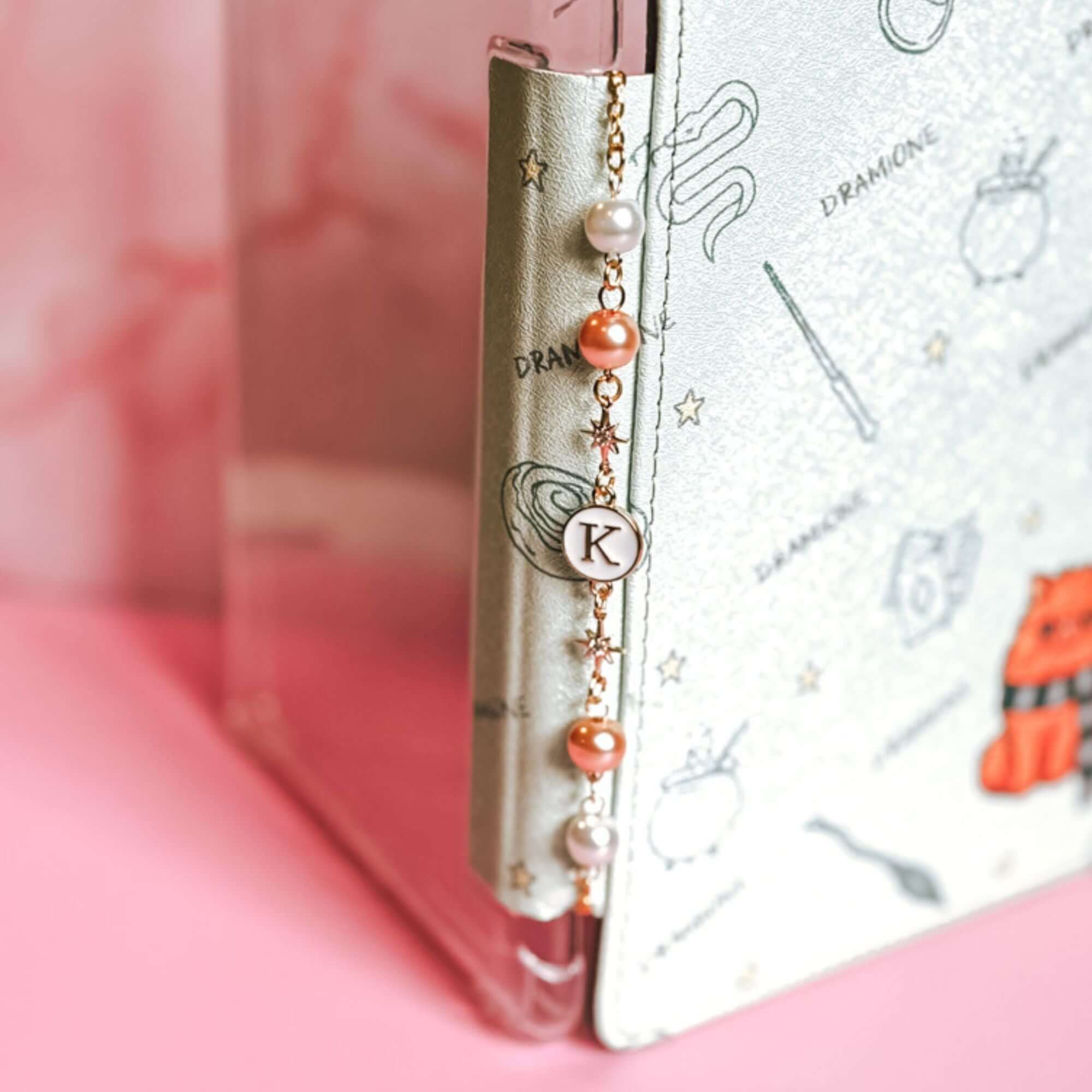 A timeless bookish charm chain for Kindle covers, adding a touch of elegance.