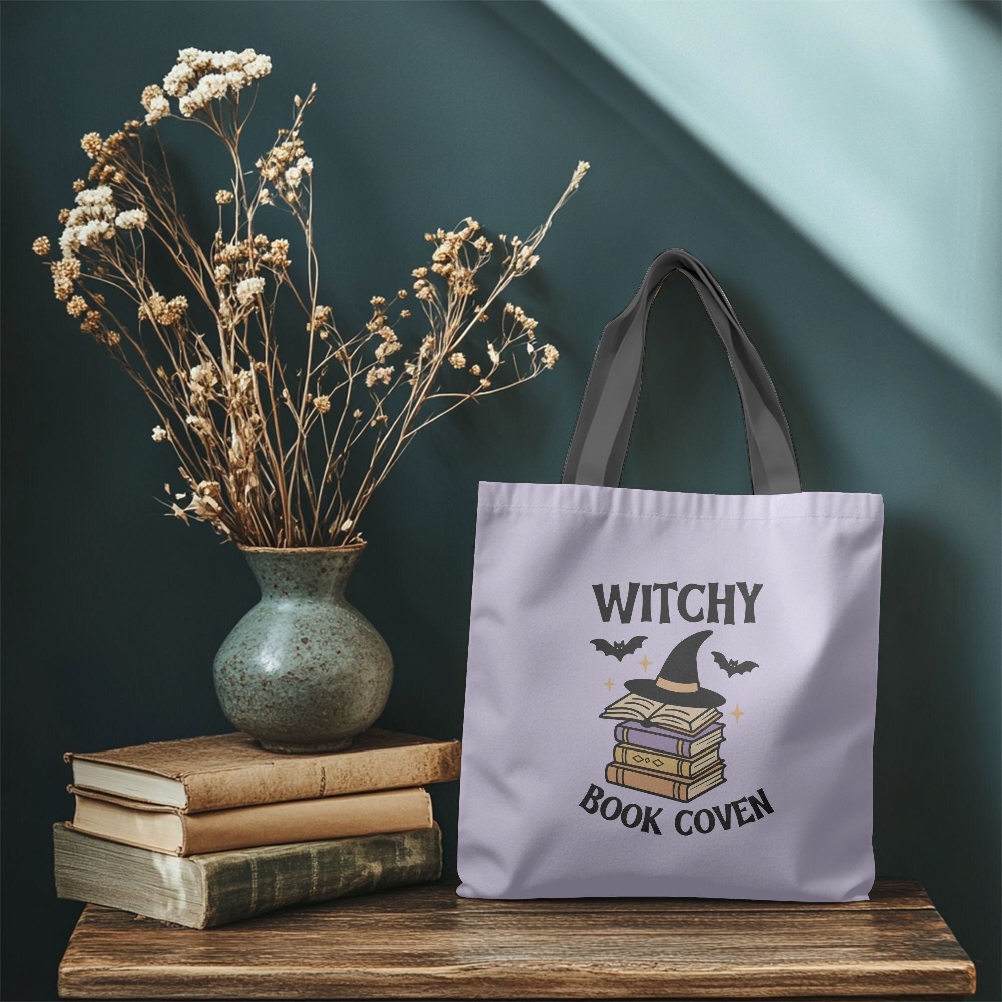 Spooky season tote bag with witch hat and books design.